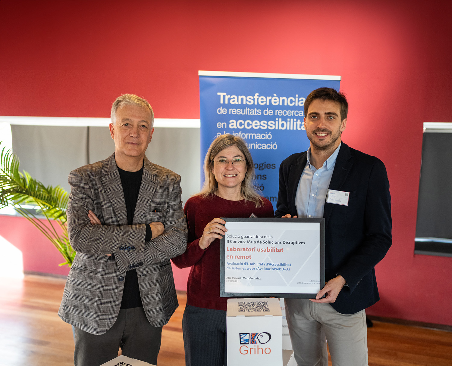 Researchers Toni Granollers, Afra Pascual, and Marc Gonzalez with the II Call for Disruptive Solutions winning diploma.